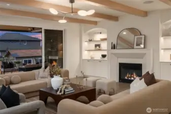 Great room flows directly to the outdoor patio through large sliding doors, ideal for indoor–outdoor entertaining. Speakers connecting the kitchen, great room, and patio keep you dancing throughout the entertaining spaces.