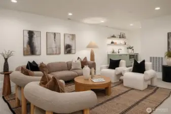 A generous lower-level bonus room designed for entertaining, featuring ample space for lounging, games, or a home theater setup.