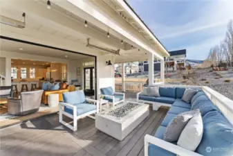 Sunny outdoor living area off the main level living room w/ NanaWall folding window walls designed for the best in indoor/outdoor living.