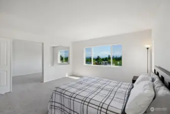 Primary bedroom with magnificent views of the mountains and sunrises. An additional; area just off the room gives you extra space to use your imagination.