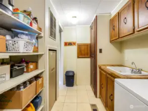 With the washer and dryer, you also have a utility sink with a cupboard.  Kitchen is to the right.