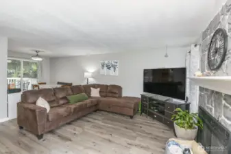 living room w/wood burning fireplace