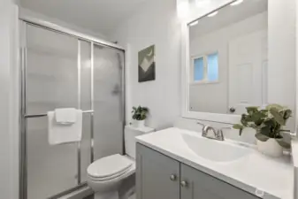 Ensuite main bath has been fully remodeled, featuring a new vanity, toilet, and shower