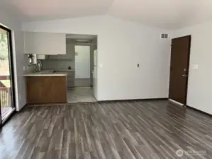 View from Family Room to Kitchen and Garage access.