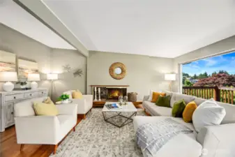 Living Room with wood burning fireplace and green/territorial views.