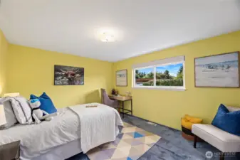 Second bedroom on main with south facing window. Original hardwood floors under carpet.