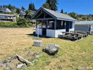 Picnic tables, and campfire  pit at the cabana