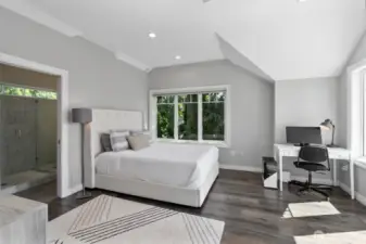 Serene upstairs bedroom with spa-like bath and sunny deck retreat.