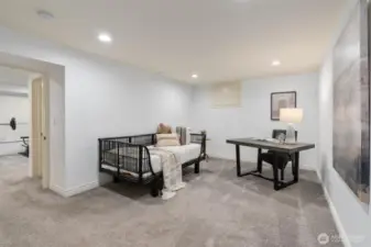 Thoughtfully designed lower level flex room offering endless possibilities as a private guest suite, remote work office, or multipurpose retreat.
