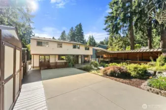 Sports court w/ 3 outbuildings for ample STORAGE.