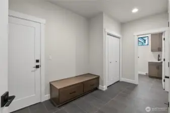 Large laundry room with utility sink.