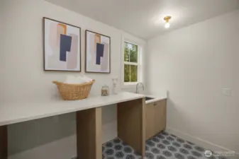 Upstairs laundry room with sink.