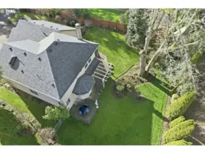 Drone shot highlights the privacy and size of the fully fenced backyard.