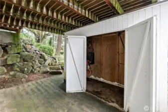 Storage and patio under the main floor porch.