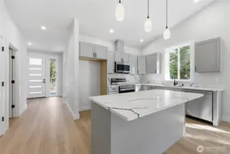 Back into the house, open door to the left is laundry and access to the garage.