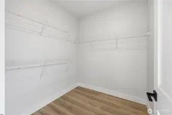 Primary walk in closet.