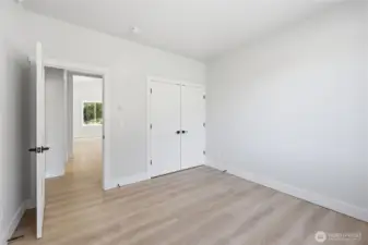 Bedroom #2, solid closet doors, custom features throughout home.