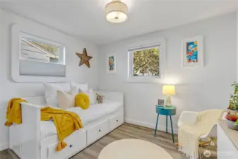 2nd bedroom with custom shades and a double closet.  Current owner used this as their media/office space