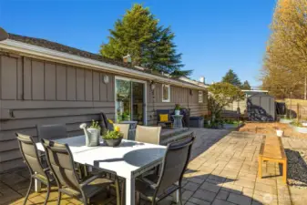 Another look at one of 2 back patios, this one an extension of the dining room, just through those sliding doors