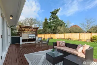 Large, level deck off the sun room with a built in gas BBQ.