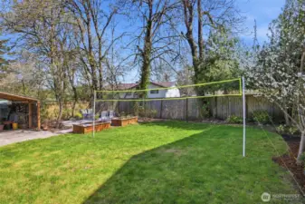 Large open leveled backyard with endless possibilities. Even a a friendly volleyball game.