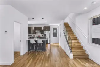 Stairs leading to Primary bed and bath as well as additional bedroom and attached  bath.