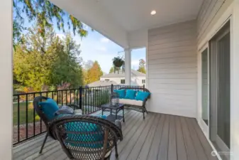 Relax and take in the fresh air on the spacious covered back porch, an ideal spot for outdoor dining or simply unwinding after a long day.