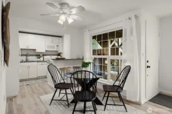 Dining area into the kitchen. You will be able to enjoy the fan during those hot summer days.