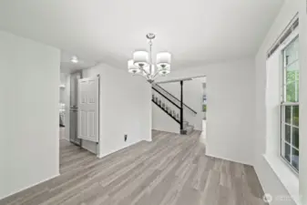 New LVP flooring throughout! This is the formal dining room, with a butlers pantry/hallway directly into the kitchen.