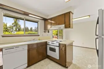 Calling all visionaries! This kitchen is ready for a glow-up. Functional layout, charming built-ins, and a sunny window over the sink make it a prime candidate for your dream renovation.