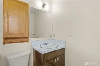Attached to the primary bedroom, this compact en suite includes a shower (not pictured) and solid layout—ready for a stylish refresh to match your vision.