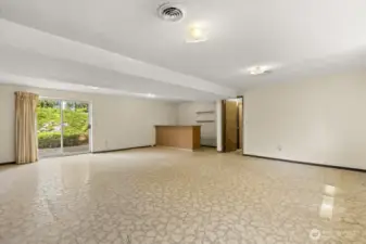 Bonus points for a bonus room! This lower-level hangout has sliding doors to the yard, built-in bar, and enough space for all the fun.