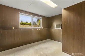 Need an office, craft room, or quiet creative corner? This lower-level den with natural light is full of potential—and it’s not afraid of a little DIY glow-up.