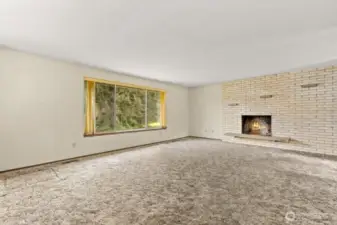 Spacious, light-filled living room with a huge picture window.