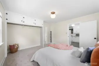 The first bedroom features a large closet, and is accessed through from the kitchen with a doorway that leads through to the next bedroom.