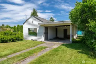 This bungalow offers one covered parking space and additional driveway parking.