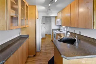 Kitchen looking thru it to the entry.  Dining area is behind photographer