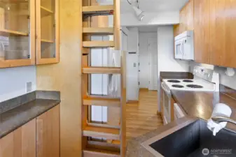 View of the kitchen.  Note the pull-out antry cabinet