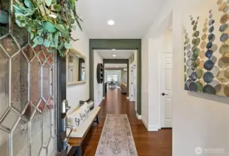 Enter on to rich, warm hardwood floors. Guest suite is to the right, the office is ahead on the right and the great room is straight ahead.