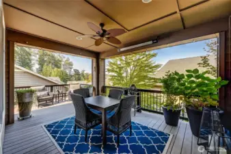 The covered portion of the deck has a ceiling fan and heaters for year round use.