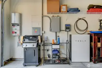 Included with the home is a Tesla electric car charger and a Tesla battery bank for the solar panels. You'll have electricity banked for power outages!
