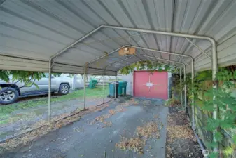 Carport structure over driveway and entrance to home.