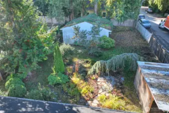 Looking South showing large lot and garage structure.
