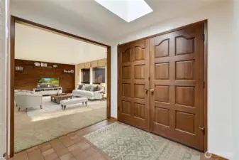 Step into a light-filled, welcoming foyer that immediately sets the tone for this charming home. Natural light streams in, creating a bright and airy entry that effortlessly flows into the spacious formal living room.  [This photo is virtually staged.]