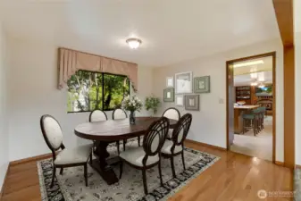 Its spacious design allows for a large table and easy flow from the living room and kitchen.  [This photo is virtually staged.]