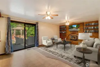 Relax and unwind in the cozy family room, where there’s plenty of space for movie nights, game days, or simply curling up with a good book.  [This photo is virtually staged.]