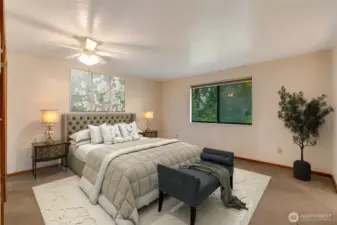 The large primary bedroom is a serene retreat, featuring dual closets for ample storage and an attached ¾ bath with dual sinks. Bright and airy, it offers a comfortable, private space to relax and recharge at the end of the day.  [This photo is virtually staged.]