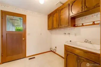 The convenient utility room with a sink makes laundry, cleaning, and household projects easier, giving you practical space without sacrificing style.