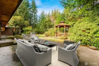 Large patio just begging for a firepit—perfect for relaxing or entertaining.  [This photo is virtually staged.]