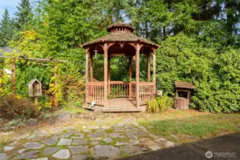 The generous backyard is both private and versatile, featuring two outbuildings, a large patio, and a charming gazebo—perfect for relaxing, entertaining, or enjoying quiet evenings outdoors. Don't forget to "make a wish."